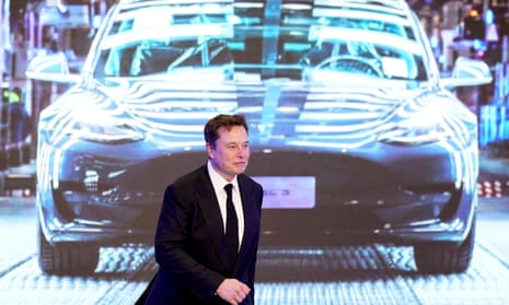 Elon Musk in front of a screen showing a Tesla Model 3 car, in January 2020.