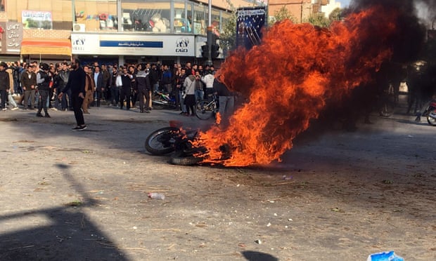 Iranian protesters clash in the streets following a fuel price increase in Isfahan, central Iran