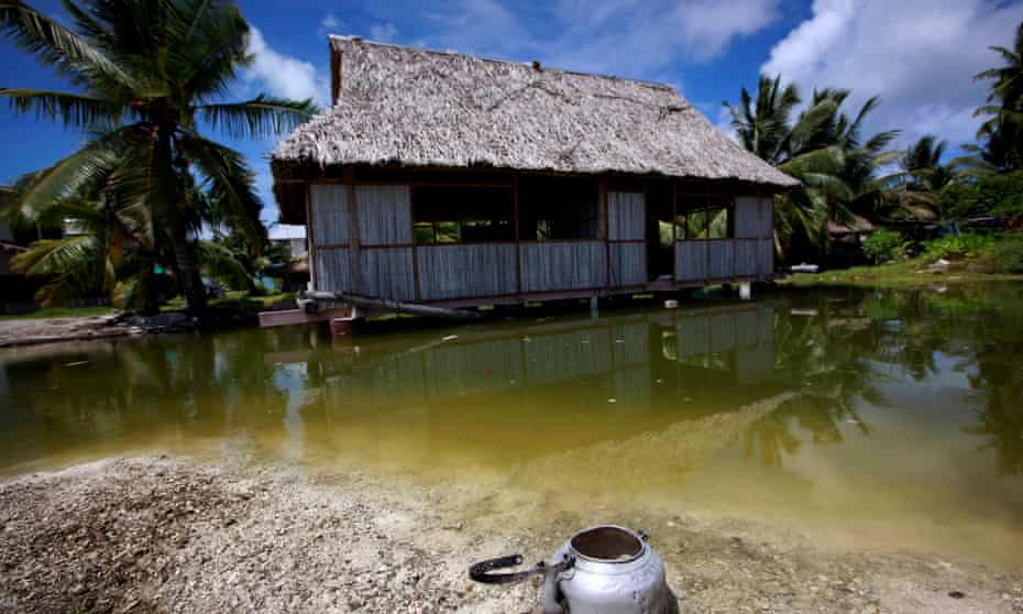 An abandoned house that is affected by sea-water during high-tides stands next to a small lagoon near the village of Tangintebu on South Tarawa in the central Pacific island nation of Kiribati.