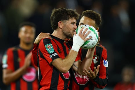 AFC Bournemouth's Ryan Christie celebrates with the match ball after the match after scoring a hat-trick.