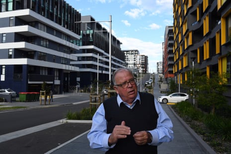 NSW Building Commissioner David Chandler in a street lined with apartment buildings in Meadowbank, NSW. 