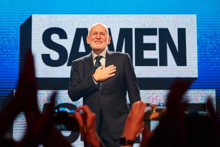 Frans Timmermans holds his hand to his heart as he speaks to a public audience