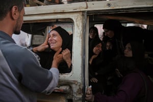 Palestinians mourn their relatives killed from an Israeli bombardment of Gaza at al-Shifa hospital