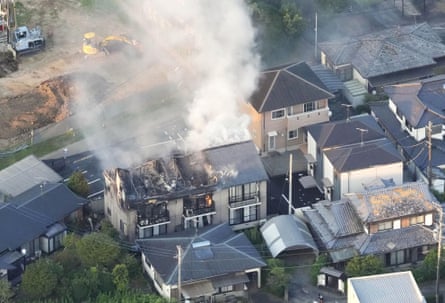 Aerial view of a house with most of its roof destroyed or on fire