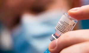 A vial of the Pfizer BioNTech vaccine at a clinic in Thurso, Scotland.