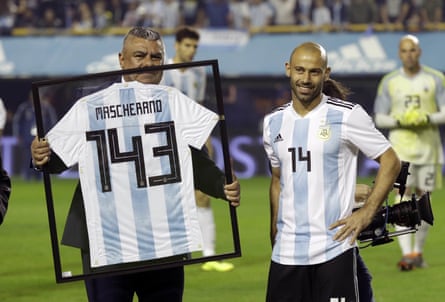 Mascherano is presented with a jersey for playing 143 games for the Argentinian team before the recent friendly against Haiti in Buenos Aires.