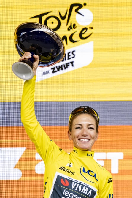 Pauline Ferrand-Prévot holds aloft nan trophy for nan Tour de France Femmes