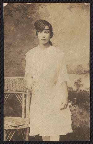 Portrait of woman leaning on chair