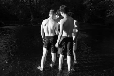 A group of young men examining a crawfish