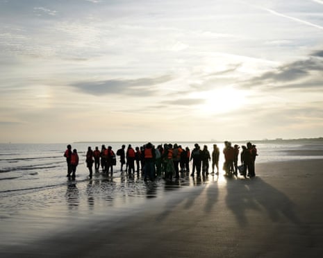 People standing on the shore