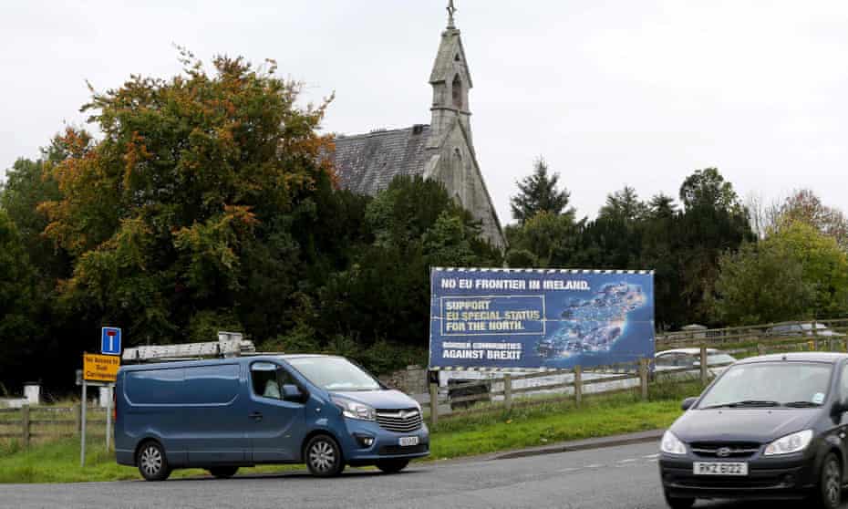 Traffic passes an anti-Brexit billboard on a road between Newry in Northern Ireland and Dundalk in the Republic