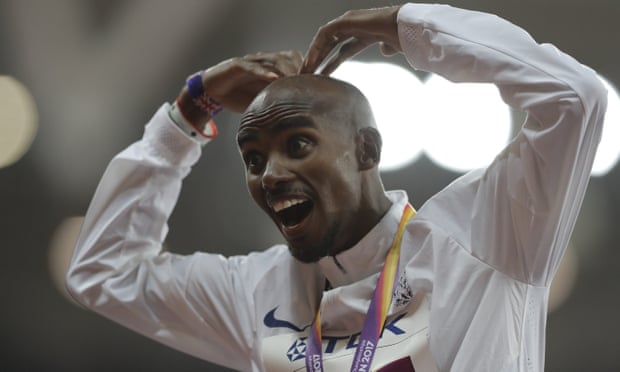 Mo Farah shows his delight after receiving his gold medal for winning the 10,000m final on day one of the World Athletics Championships.