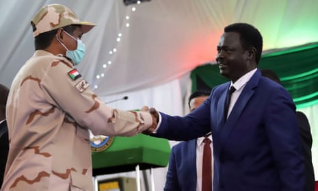 Lt Gen Mohamed Hamdan Dagalo and Minni Minnawi, the head of the Sudan Liberation Army, shake hands after agreeing to the peace deal