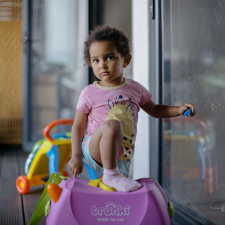Joanna’s middle child, Mia, poses for a photo on their balcony.