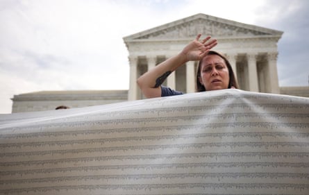 An anti-abortion activist holds a petition to end abortion during a demonstration outside of the Supreme Court on 4 October 2021 in Washington DC.