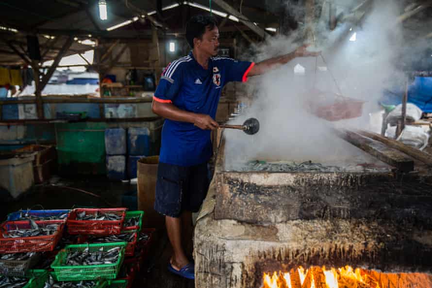 A workers at a salted fish processing business in Muara Angke.