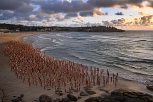 Thousands of people stand naked as part of an installation by the contemporary artist Spencer Tunick at Bondi beach in Sydney, Australia