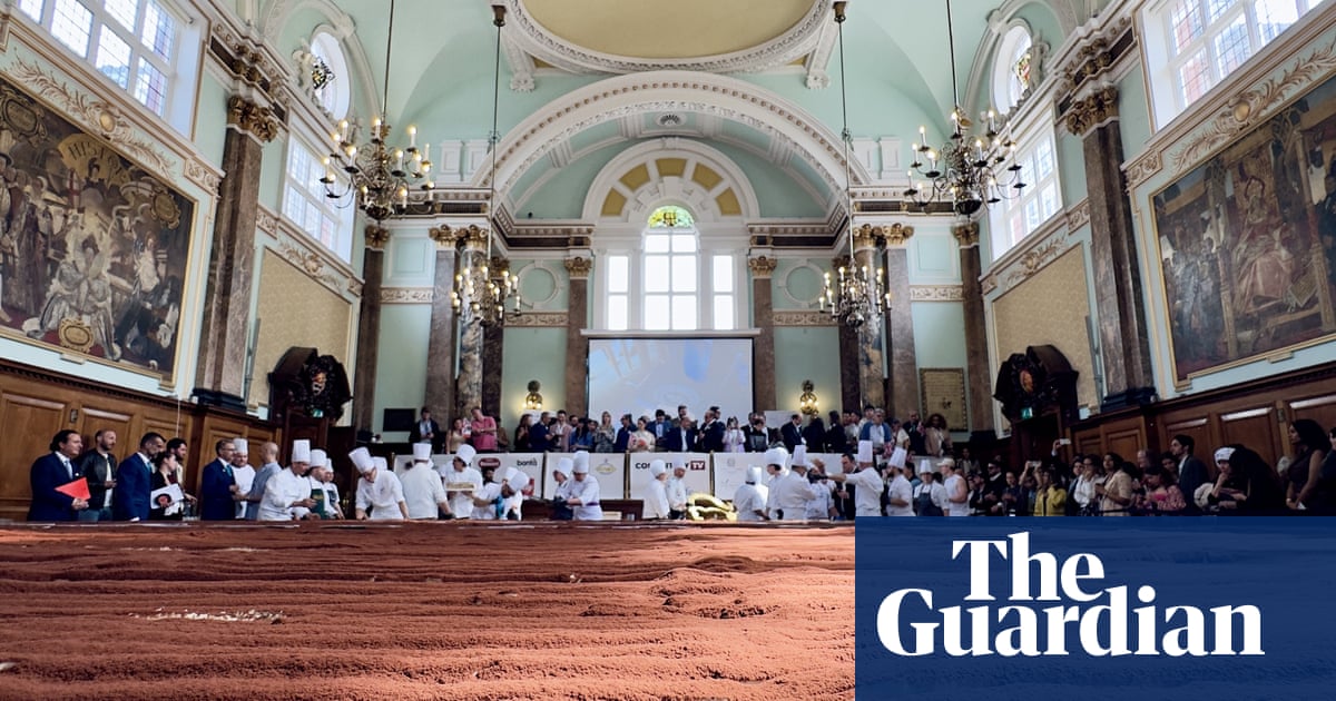 Two tonnes of mascarpone and 19,000 eggs: chefs make world's longest tiramisu – video