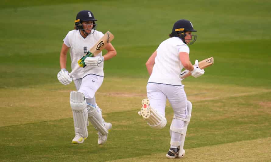 Nat Sciver and Alice Davidson-Richards of England run between the wickets.