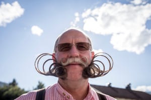 A contestant of the World Beard And Mustache Championships poses for a picture during the opening ceremony of the Championships 2015