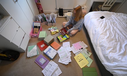 A Year 11 student ponders over her school books and revision materials after the premature end to her school year.