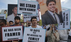 Supporters of Kamer Nizamdeen protest