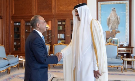 Qatar’s Emir Sheikh Tamim bin Hamad al-Thani shakes hands with Egypt’s foreign minister Badr Abdelatty in Doha on 31 July.