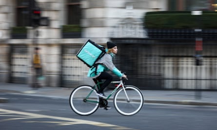 A Deliveroo rider on the road in London.