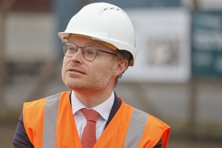 Energy minister Michael Shanks wearing a hard hat and hi-vis vest.