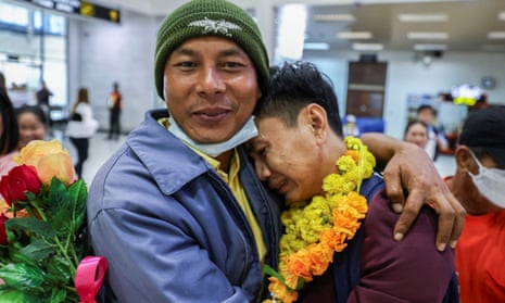 Twenty-six-year-od Natthaporn Onkaew (right) is welcomed back to Thailand on Friday by family and friends
