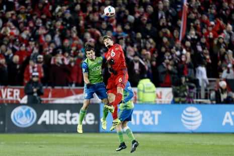 Seattle Sounders forward Nelson Haedo Valdez (16) and Toronto FC defender Nick Hagglund (6) go up for the ball.