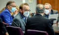 \Travis McMichael, left, speaks with his attorney Bob Rubin, right, during the sentencing of his and his father Greg McMichael and neighbor William ‘Roddie’ Bryan in January. 