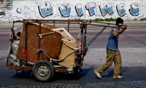 A littler picker in Buenos Aires pushes a cart full of recyclables. Recently, the Argentinian capital has made efforts to invest in recycling programs with the aim to reduce the amount of solid waste that ends up in landfill.