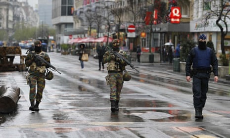 Soldiers patrol in central Brussels after security was tightened in Belgium.
