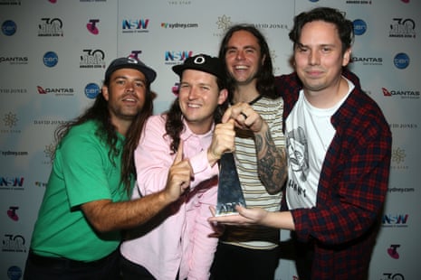 Violent Soho pose in the awards room with one of their Arias.