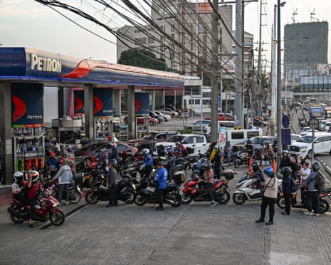 Motorists queue at a petrol station amid rising prices in Quezon City, Metro Manila