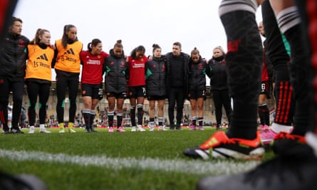 Marc Skinner talks to players and staff at the end of the Women’s Super League match between Manchester United and Aston Villa at Leigh Sports Village on 28 January 2024