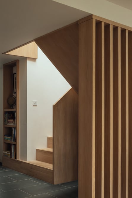 The bottom of the cottage’s wooden staircase, wide enough for a stairlift.