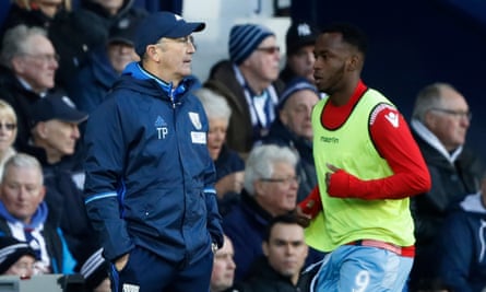 Stoke City’s Saido Berahino warms up as West Bromwich Albion manager Tony Pulis looks on.