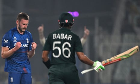 Gus Atkinson celebrates after taking the wicket of Pakistan's captain Babar Azam.
