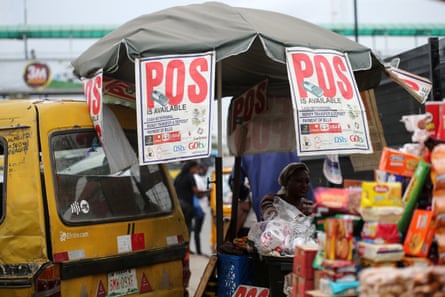 Point-of-sale money transfers are advertised at a street stall in Lagos, Nigeria.