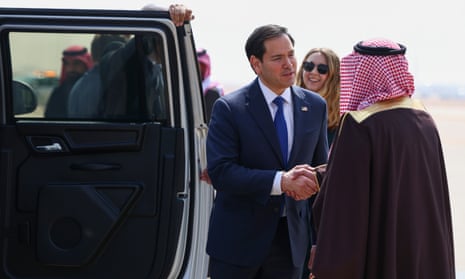 Marco Rubio shakes hands with Saudi Arabia’s deputy minister for protocol affairs Abdulmajeed Al-Smari, as he arrives at King Khalid international airport in Riyadh, Saudi Arabia.