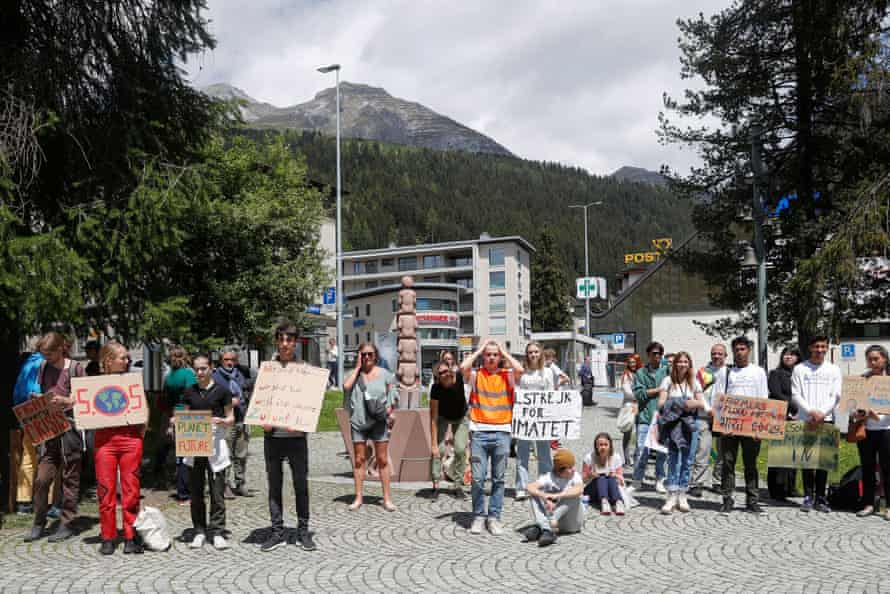 Activists from Fridays for Future hold a climate strike at World Economic Forum, in DavosClimate activists hold signs, during a Fridays for Future climate strike on the last day of the World Economic Forum (WEF), in the alpine resort of Davos, Switzerland May 26, 2022. REUTERS/Arnd Wiegmann