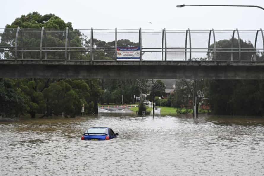 A car abandoned in floowaters in Lansvale in Sydney’s south-west.