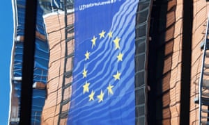 The EU commission headquarters reflected in the windows of the EU council building in Brussels.