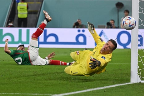 Wojciech Szczesny sees the ball past his post.