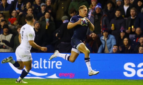 Scotland’s Duhan van der Merwe scampers towards the line before scoring their third try to complete his hat-trick against England.