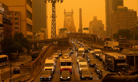 Traffic goes over the Ed Koch Queensboro Bridge as smoke from Canadian wildfires casts a haze over New York City on 7 June.