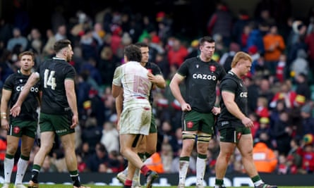 Wales players show their dejection after defeat by Georgia
