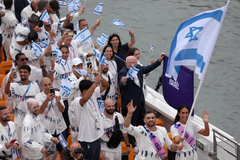 Andrea Murez and Peter Paltchik, flagbearers of Team Israel, on the River Seine during the opening ceremony of the Paris Olympics